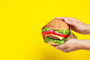 Concept of tasty food with delicious burger