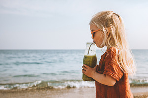 Child girl drinking smoothie vegan healthy lifestyle detox fruit beverage  brea, a Person Photo by e v e r s t