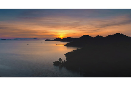 Sunset illuminating calm sea and