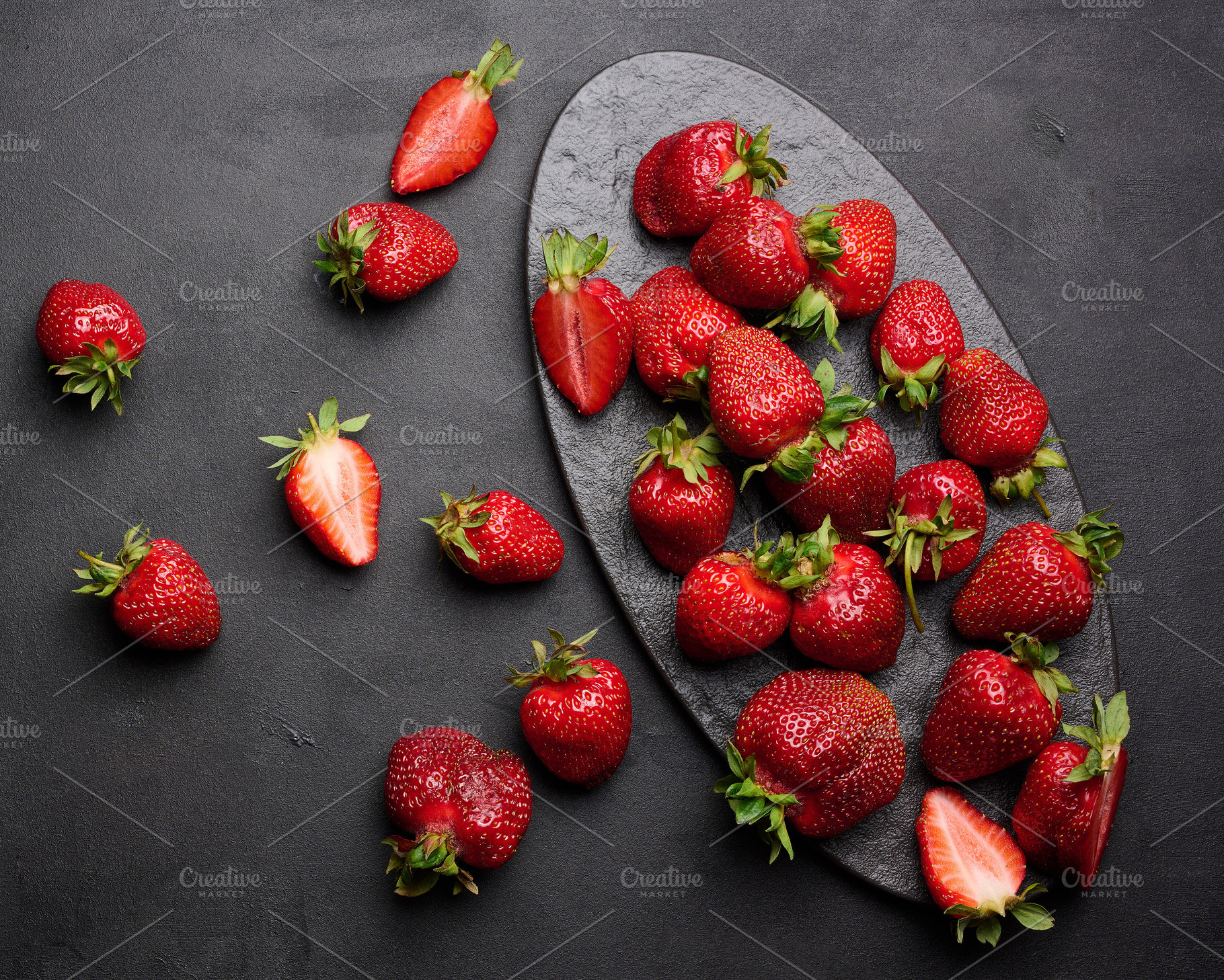 Fresh ripe strawberry on a dark background, whole berries and sl, a Food & Drink Photo by ndanko
