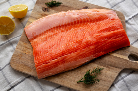 Organic Raw Salmon Fillet on a wooden board, top view. Flat lay,, a Food & Drink Photo by LiudmylaChuhunova