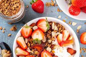 Healthy breakfast bowl with granola, yogurt and strawberry, a Food & Drink Photo by Rimma