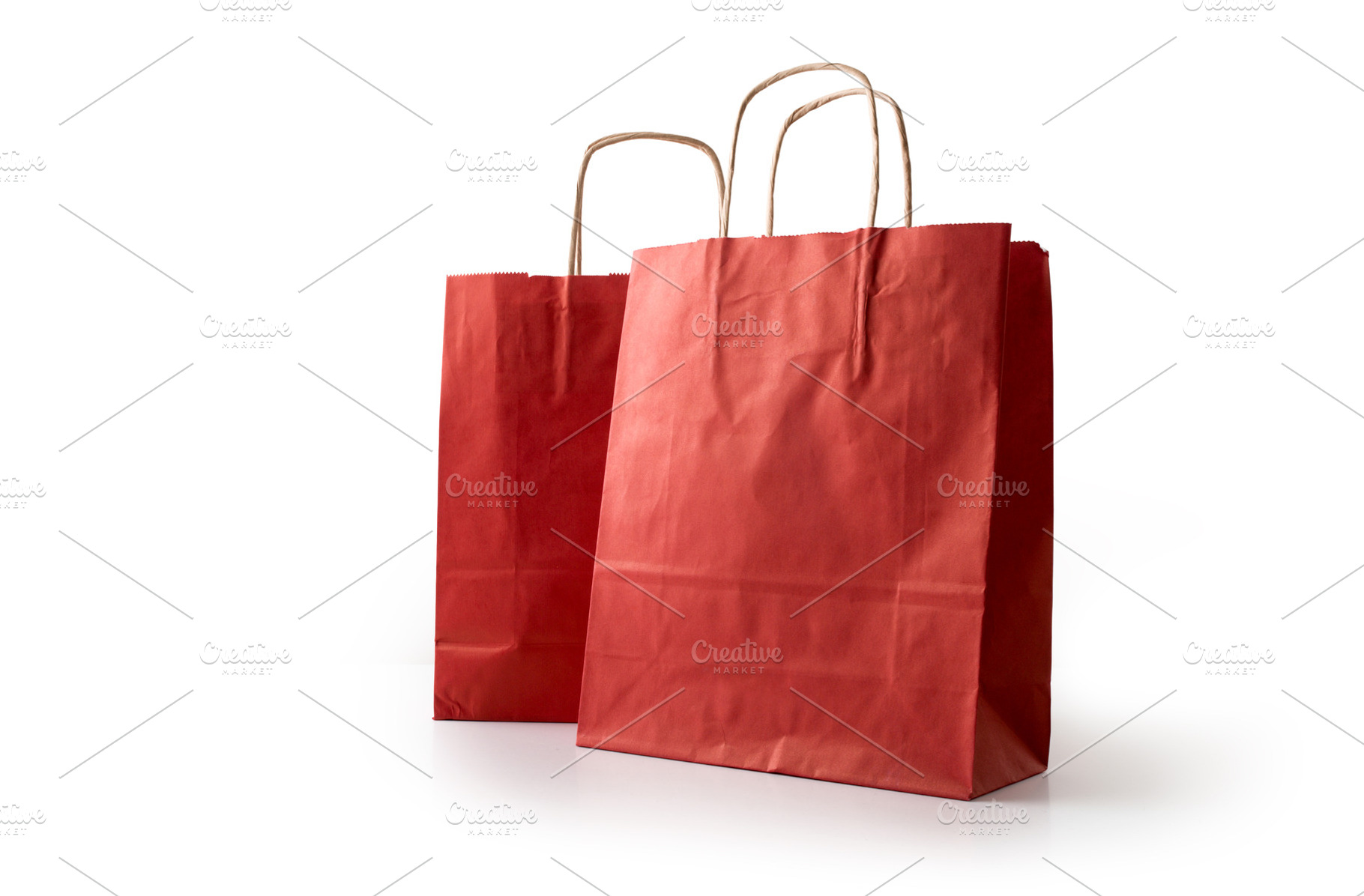Two empty red paper shopping bag cut out white, a Holiday Photo by Davizro's Market