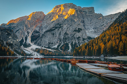 Wooden boats on the lake Braies, a Nature Photo by Alpine Dreams