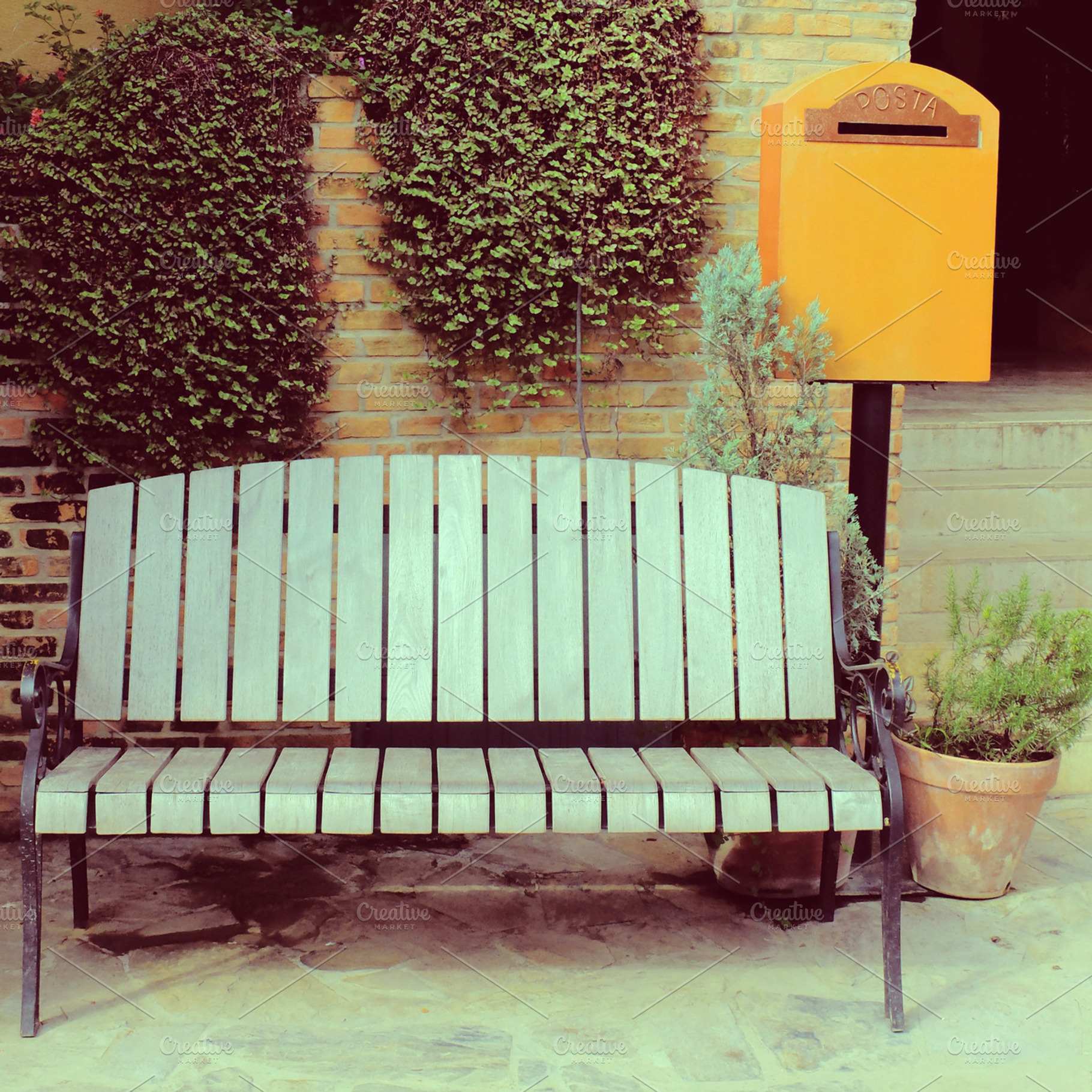 Chair with vintage mailbox in garden