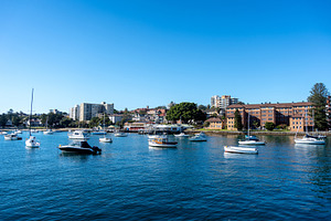 Manly Beach harbor with boats and waterfront buildings in Sydney, a Nature Photo by GoodGoods