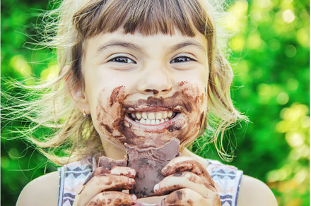 A sweet-toothed child eats chocolate, a Person Photo by yanadjana