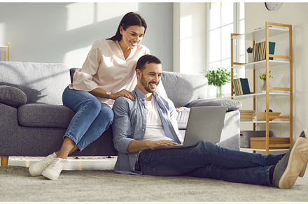 Young couple sitting on sofa in the, a Person Photo by StudioRomantic