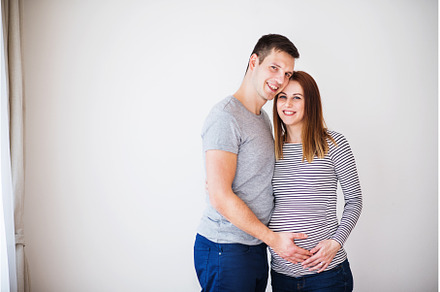Pregnant woman and her partner, a Person Photo by HalfPoint