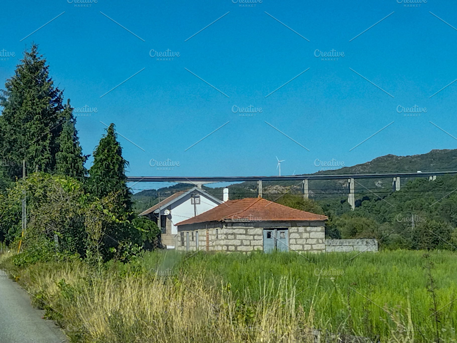 Empty rural scene with houses and bridge, an Architecture Photo by DanFLCreativo