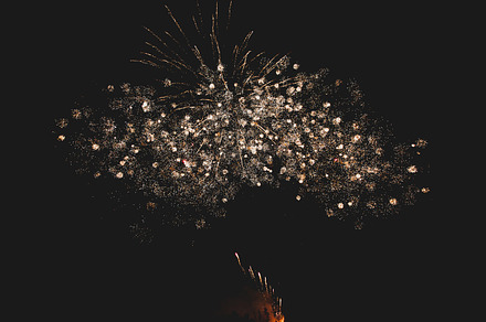 Fireworks in night sky containing abstract, background, and beautiful