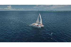 Catamaran sailing near Kuata island, a Nature Photo by Goinyk