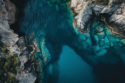 Bright blue waters reflect the sunli, a Photo by Tanuart