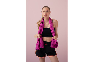 Sporty young woman standing with a, a Sports & Recreation Photo by undrey
