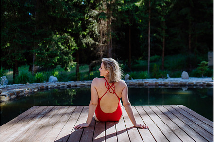 Rear view of young woman in swimsuit, a Nature Photo by HalfPoint