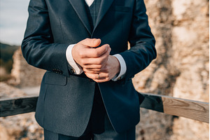 Close-up shot of groom adjusting his, a Beauty & Fashion Photo by HalfPoint