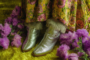 Fashion boots next to purple flowers, a Photo by Beautiful things