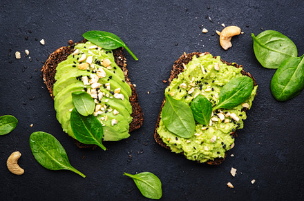 Avocado sandwich or toast on rye bread with spinach, crushed cas, a Food & Drink Photo by 5PH