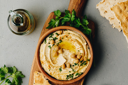 Large bowl of homemade hummus garnis featuring above, appetizer, and arabic, a Food & Drink Photo by Natalia Klenova's Shop