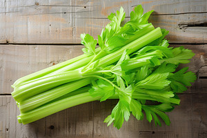 Green fresh celery sticks on wooden background, a Food & Drink Photo by AlyaAnd