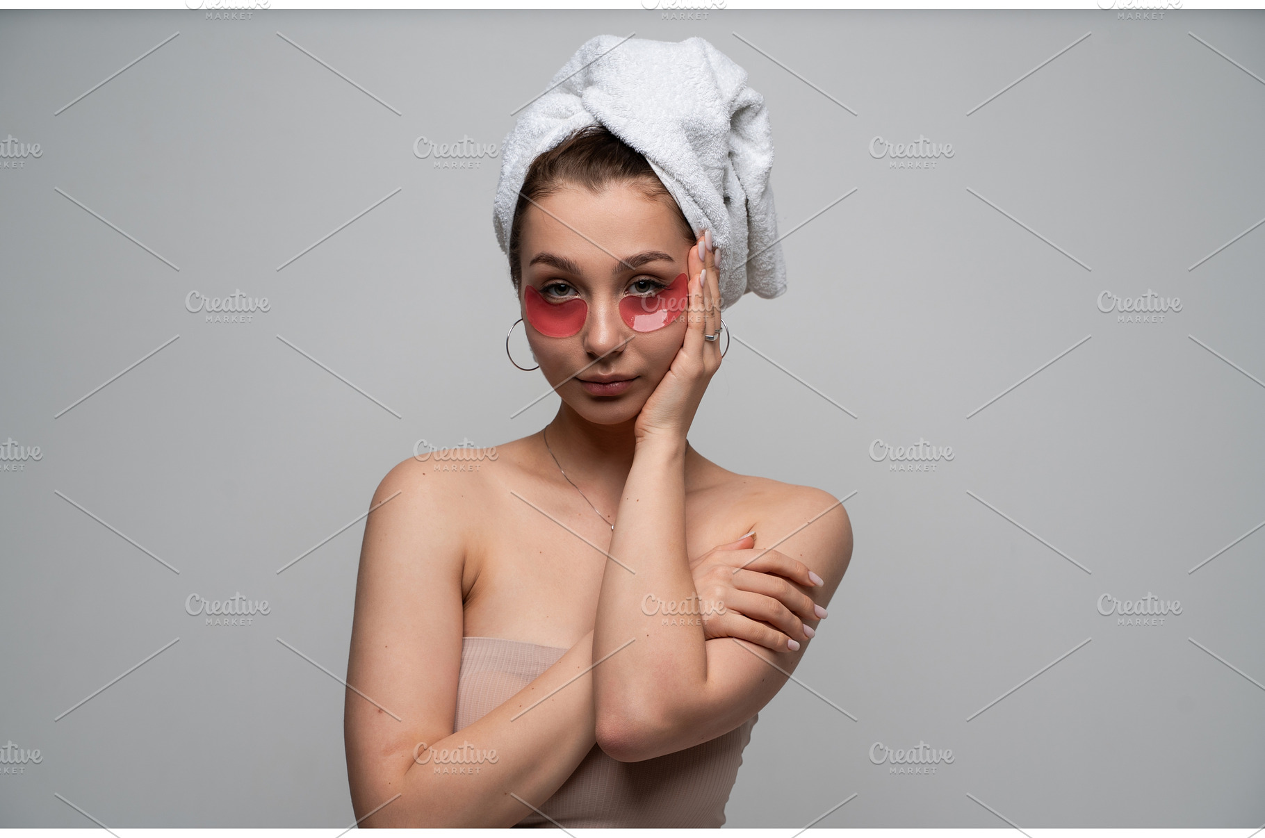 Young woman applying red hydrogel, a Health & Medical Photo by volodymyrshtun13795