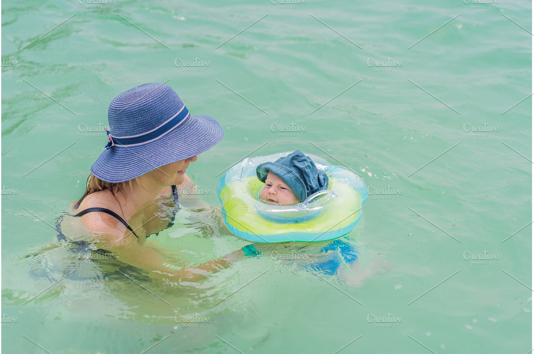 Baby floating in a neck ring in, a Person Photo by Elizaveta Galitskaya