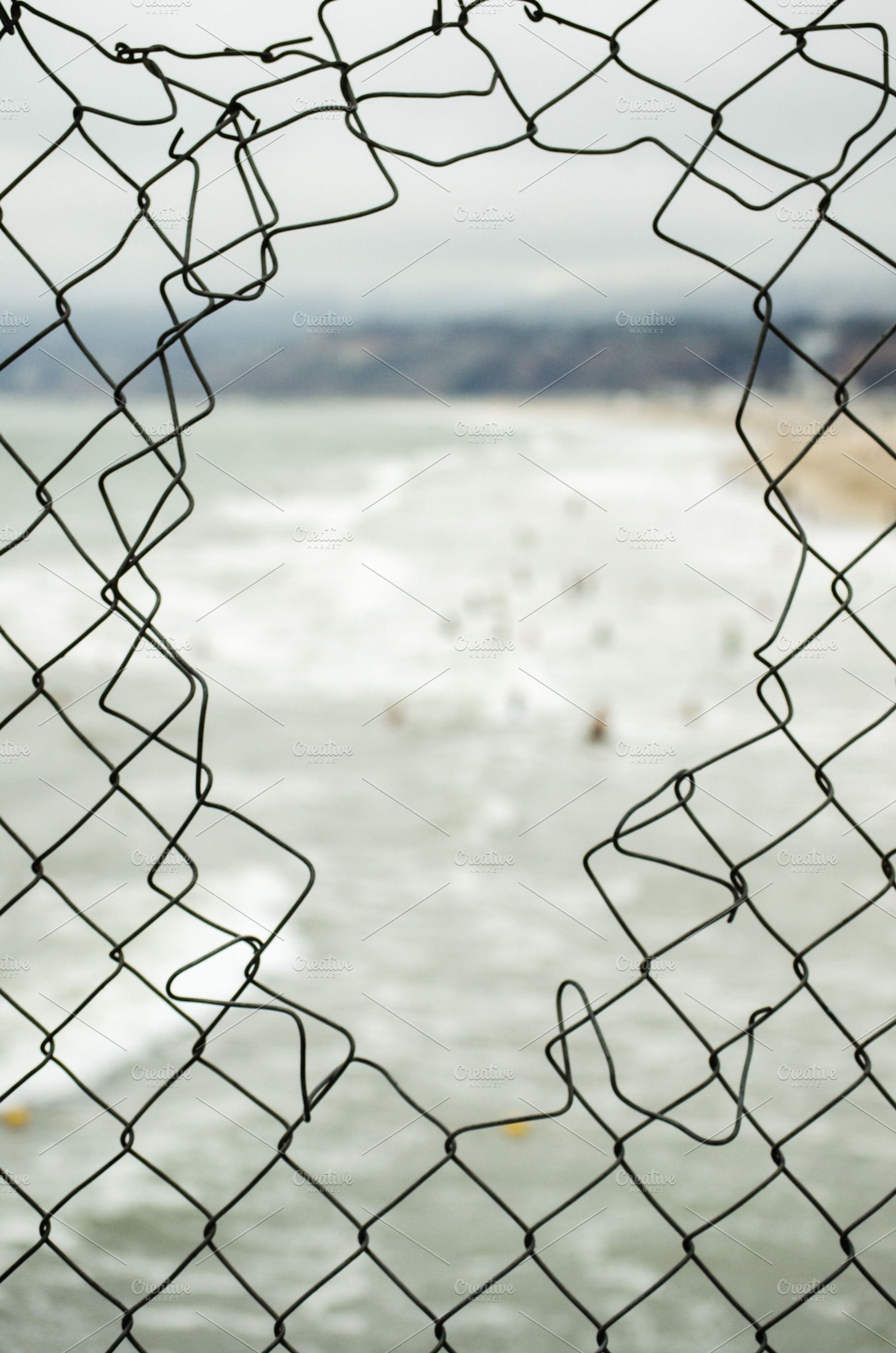 Ocean and Fence, an Abstract Photo by Catchline Studios