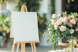 White easel with flowers, a Holiday Photo by VetalStock
