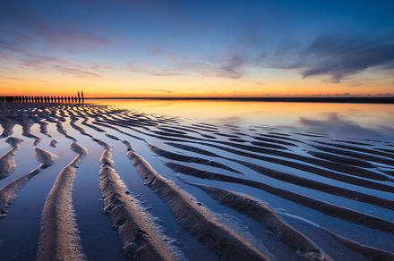 Lines of sand on the seashore., a Nature Photo by Landscape and travel