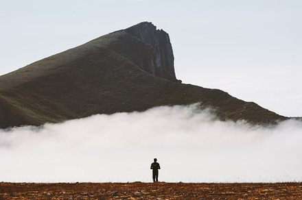 Traveler hiking alone in mountains, a Sports & Recreation Photo by e v e r s t