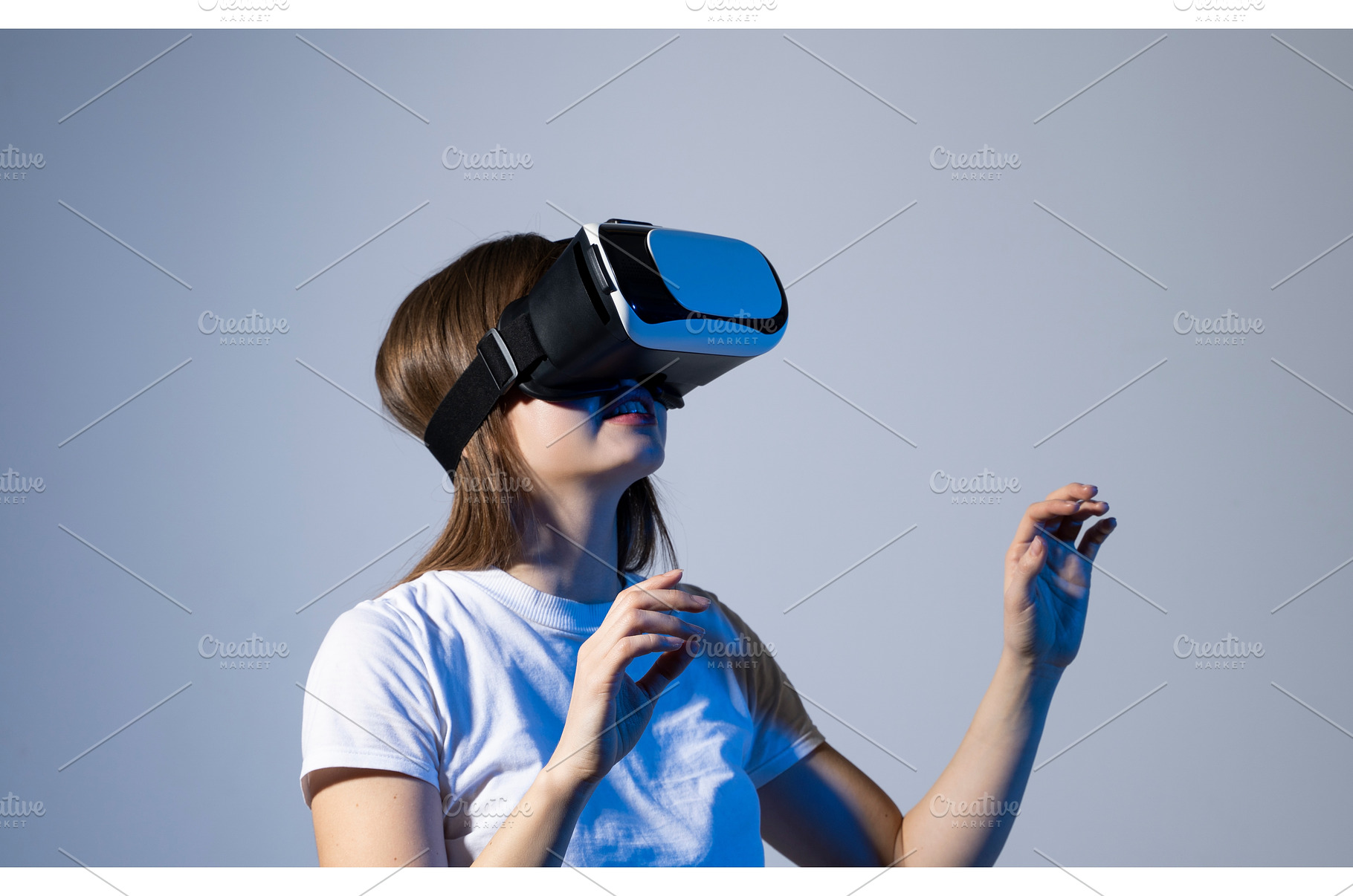 Brunette woman in white t-shirt, a Technology Photo by volodymyrshtun13795