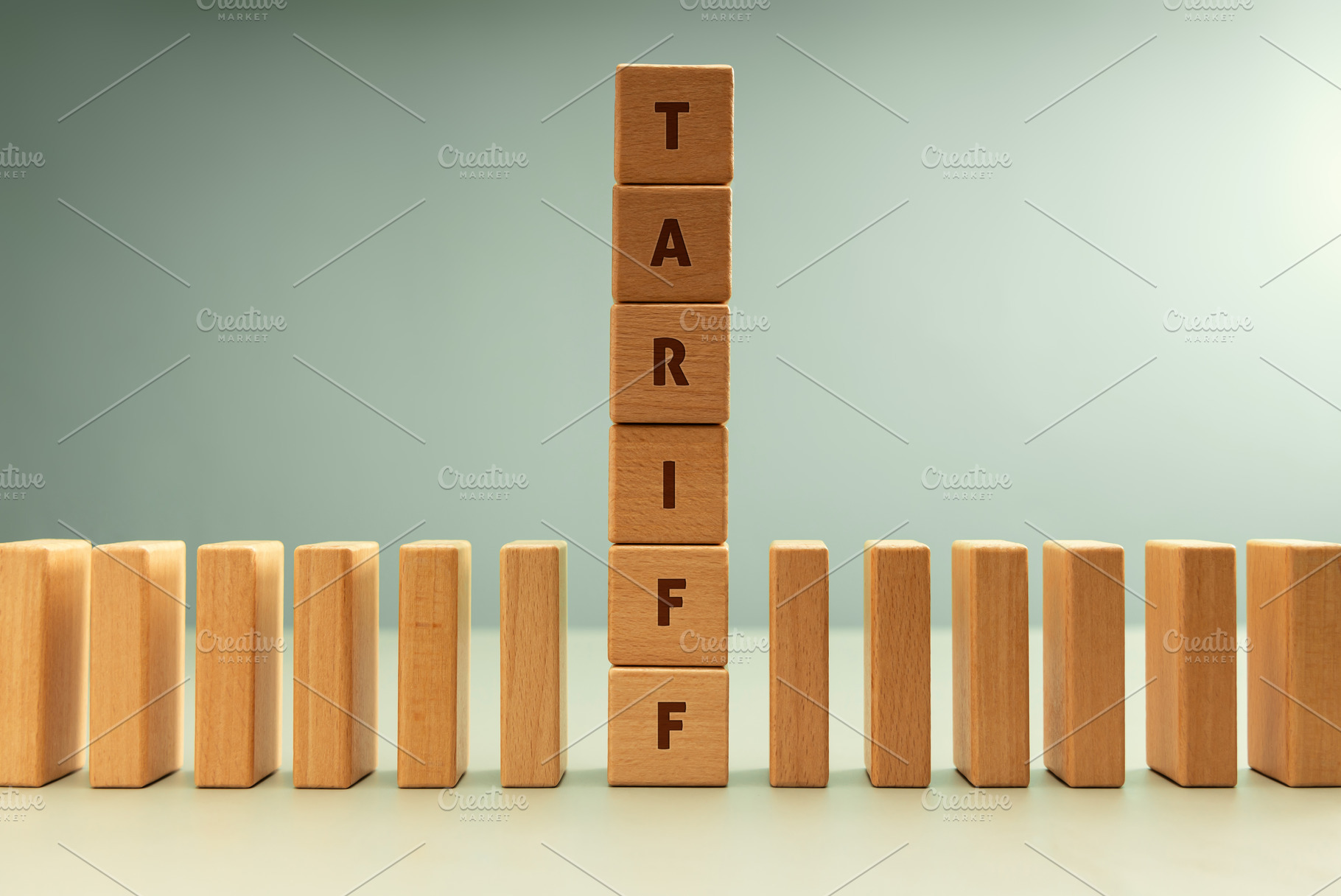 Dominoes row with vertical stack labeled TARIFF, Trade barriers, a Photo by salmon.black