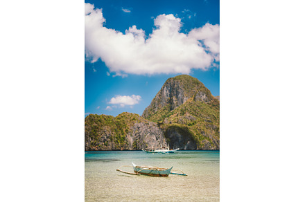Boat in El Nido bay and Cadlao, a Nature Photo by Igor Tichonow