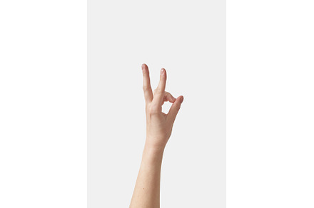 Close up woman hand OK gesture on, a Person Photo by Yaroslav Danylchenko