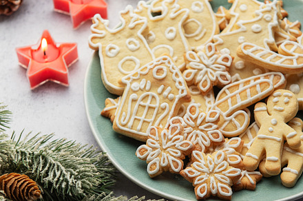 Christmas cookies decorated with icing celebrating christmas eve, a Holiday Photo by Olena Rudo