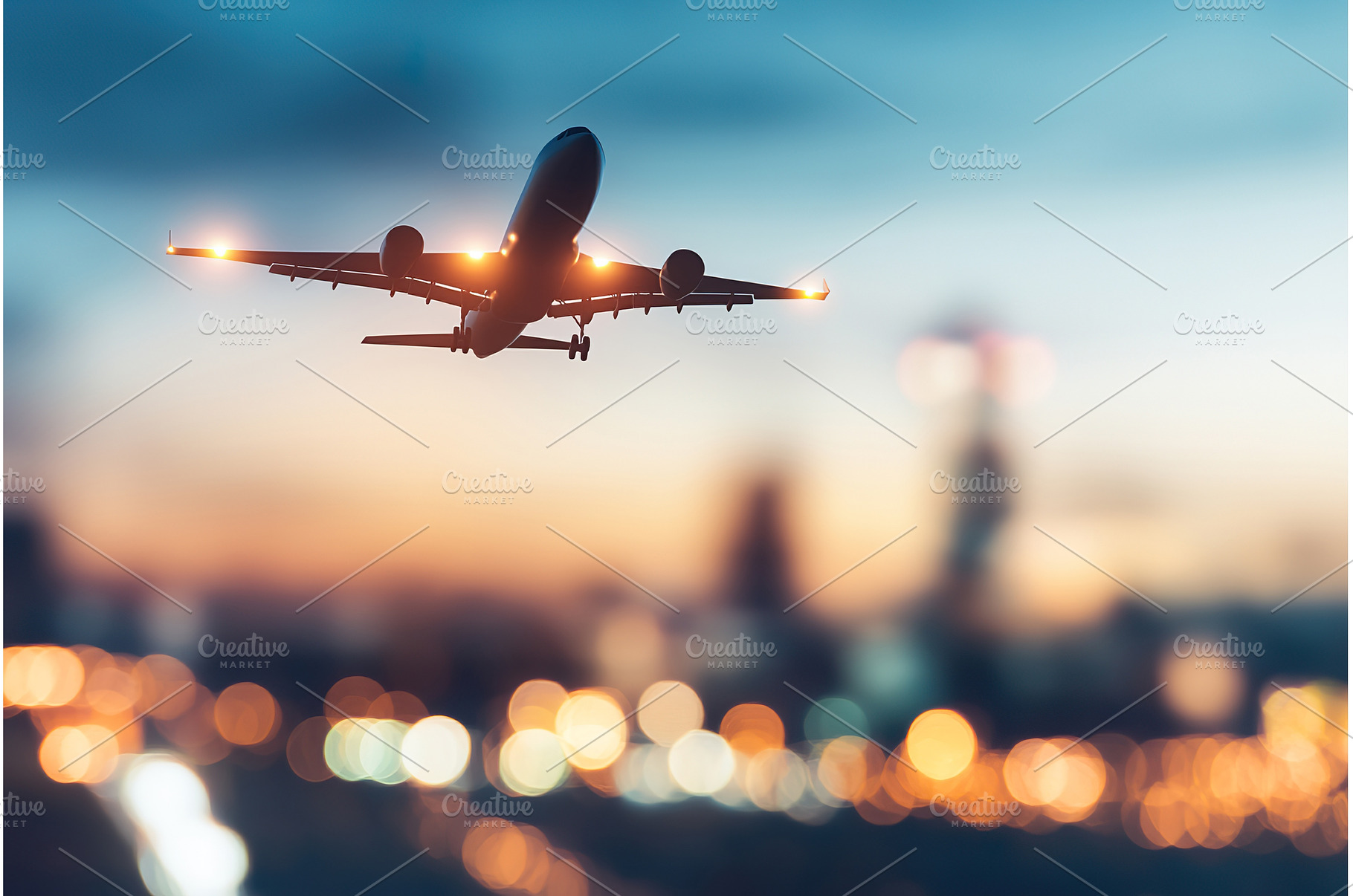 Airplane flying at dusk with city, a Transportation Photo by Lermont51