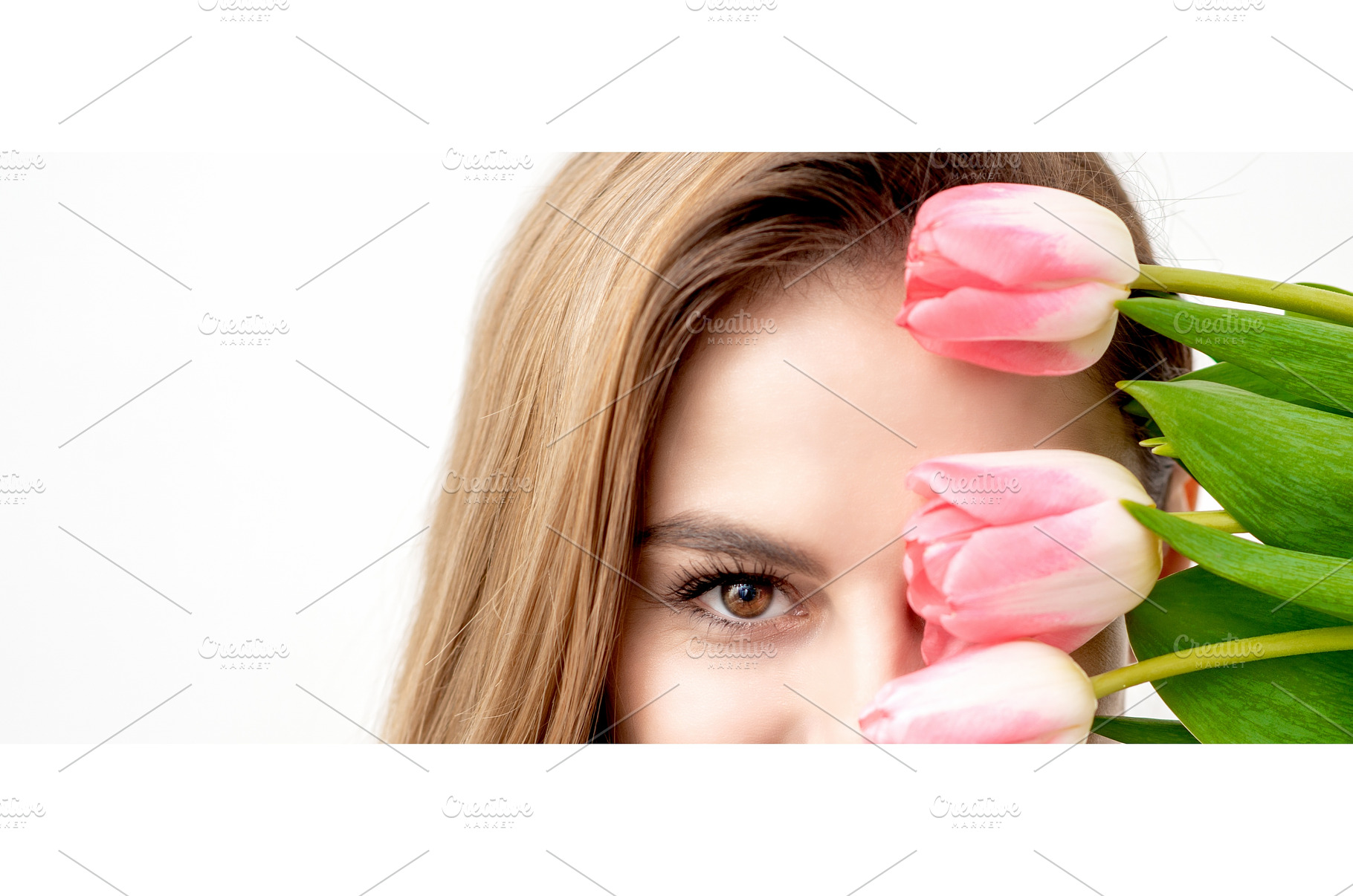 Young woman with pink tulips, a Beauty & Fashion Photo by okskukuruza
