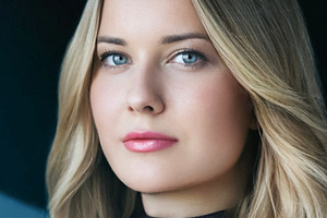 Woman with blonde hair and blue eyes looking directly at camera,, a Person Photo by Studio ANNA