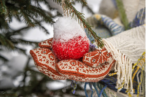 Hands in knitted mittens hang a red, a Holiday Photo by COLORFUL