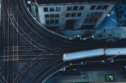 Chicago cta train overhead view containing train, intersection, and crossroad