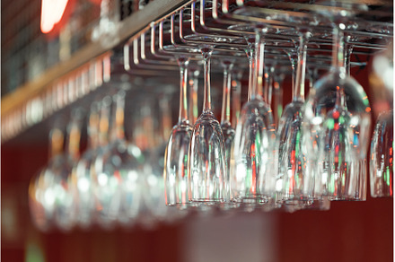 Hanging champagne glasses at the bar, a Food & Drink Photo by Barcelona_dreams