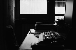 office with desktop pc in bw, a Photo by WorldOfPhotos