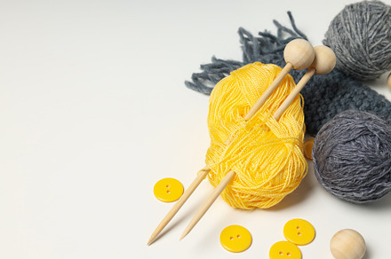 Concept of hobby, knitting, space for text, a Beauty & Fashion Photo by AtlasStudio