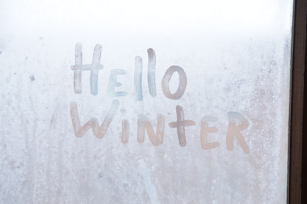 Hello winter concept. Frozen glass i