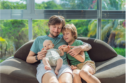 Father, son, and newborn baby