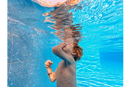 Little boy in swimsuit diving in, a Sports & Recreation Photo by HalfPoint