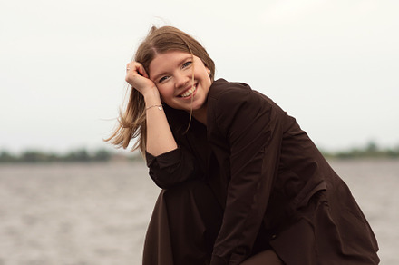Smiling woman in brown suit