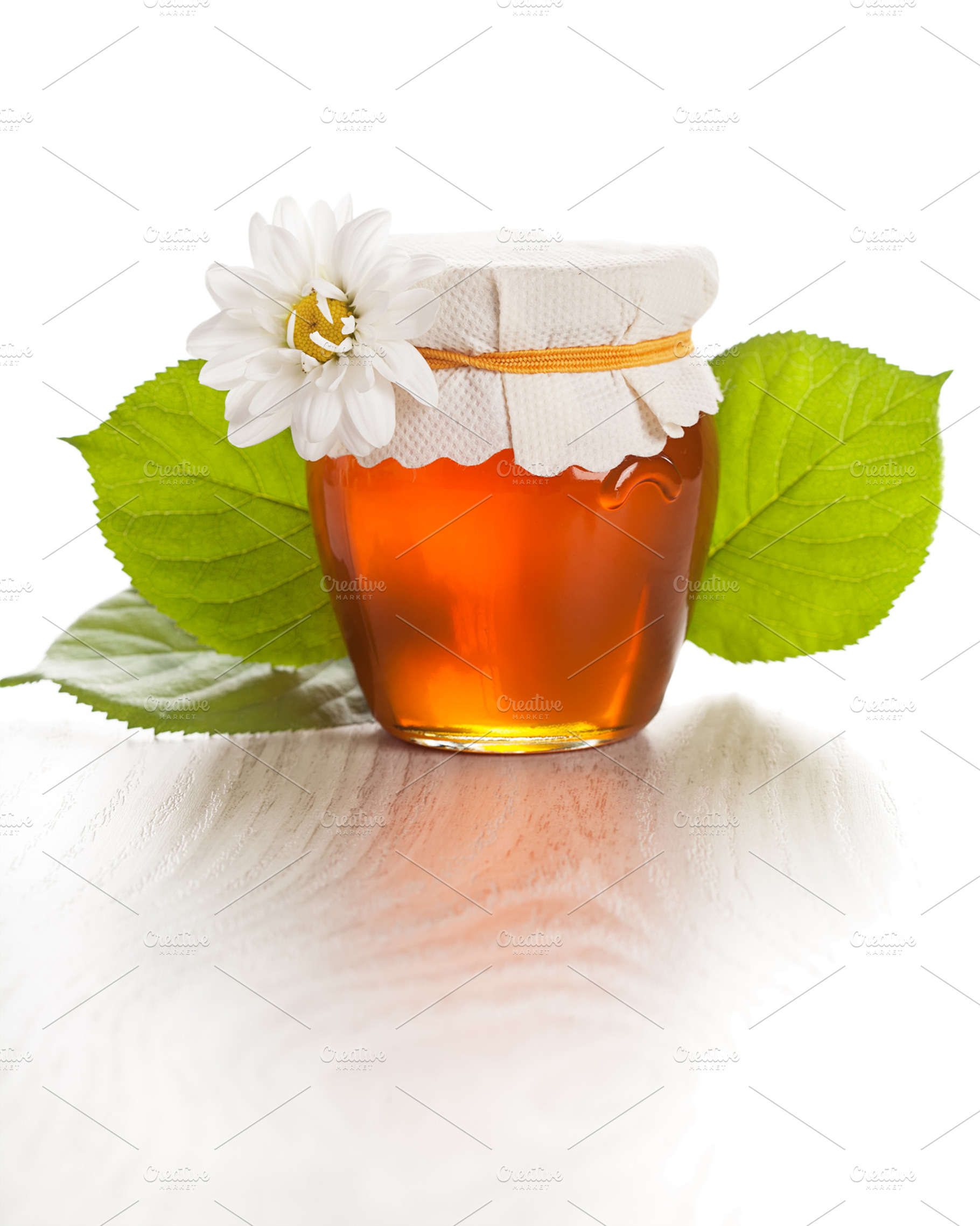 Glass jar with honey containing background, closeup, and color