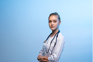 Female doctor wearing white coat and, a Health & Medical Photo by volodymyrshtun13795