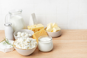 Dairy products assortment including milk, cheese, butter, yogurt, a Food & Drink Photo by Olena Rudo